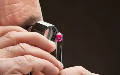 Jeweler Looking at Pink Lab Grown Diamonds